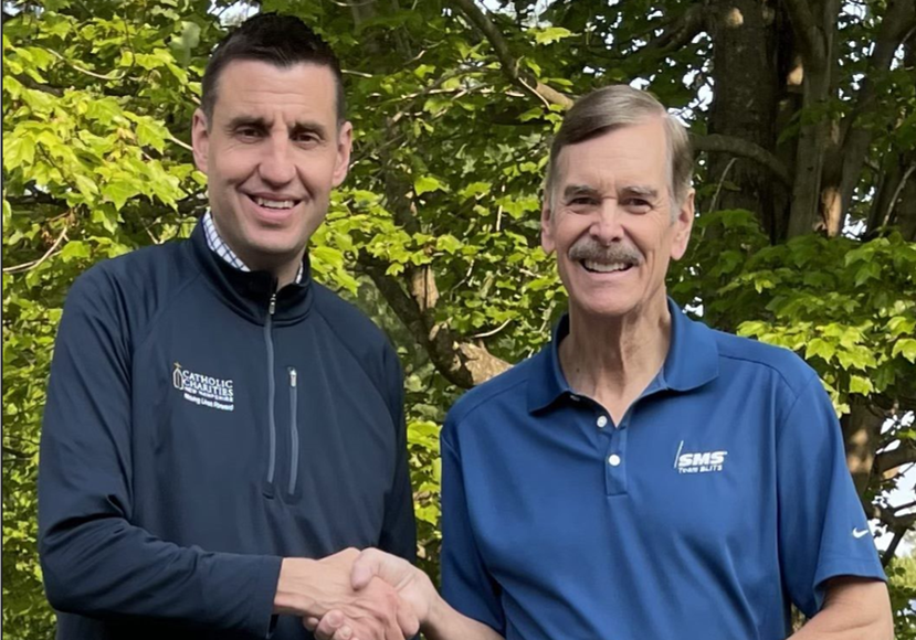 Dave 3 Dave Latina donating on behalf of SMS to Michael McDonough, Catholic Charities of NH Executive Director